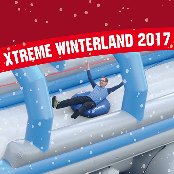 Werbebild „Xtreme Winterland 2017“ mit einem Rutschenden auf einer aufblasbaren Schneebahn